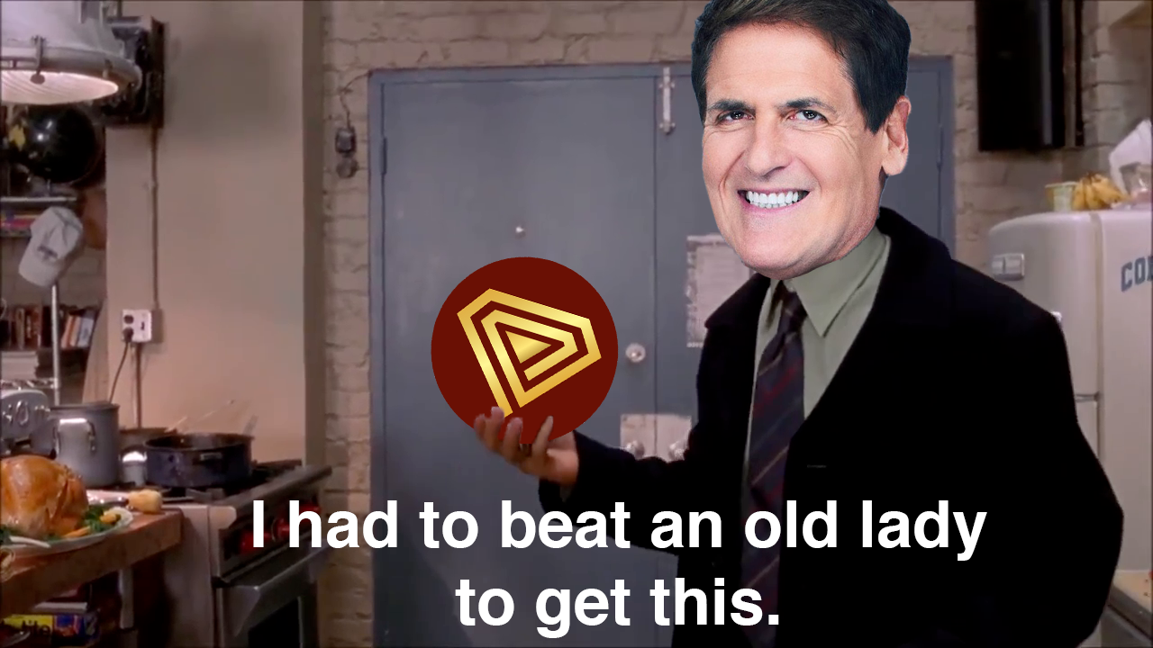 Cuban holding TITAN coin — 'I had to beat an old lady to get this'